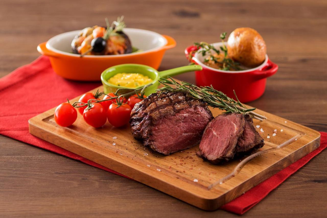 Hong Kong Gold Coast Hotel Exteriör bild A steak prepared with the dry-aging technique